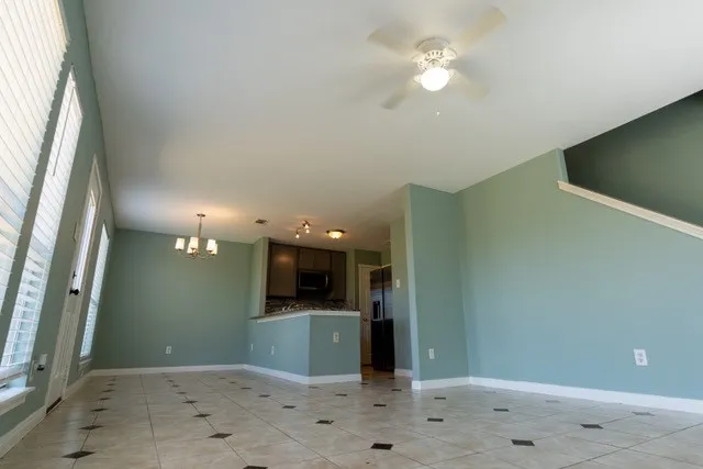 a view of a hallway with a kitchen