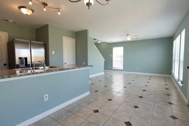 a view of kitchen with center island and living room