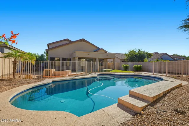 a view of a swimming pool with a patio
