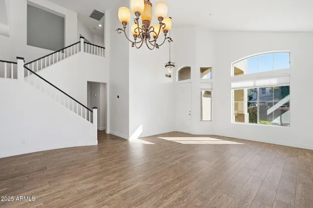 a view of an entryway with wooden floor
