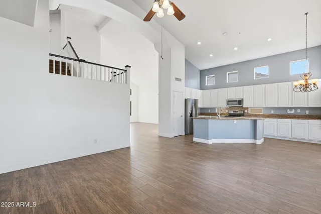 a view of kitchen with cabinets and wooden floor