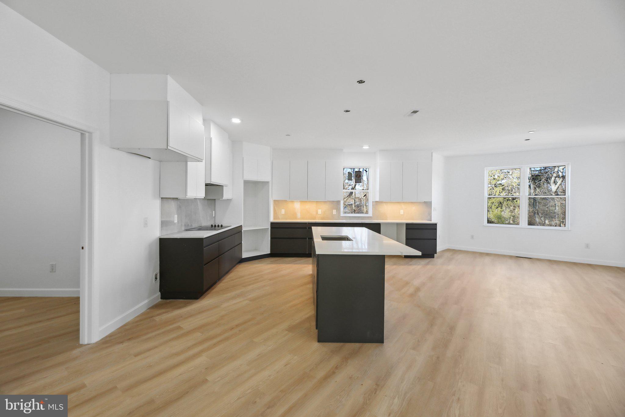 8325 Grove Angle Road Ellicott City, MD 21043 - Photo 11 of 57 a view of kitchen with wooden floor and electronic appliances
