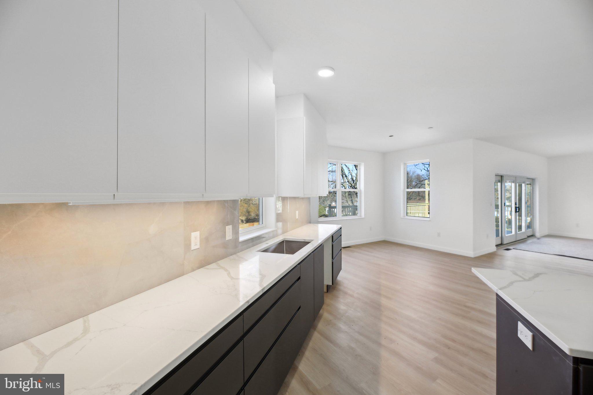 8325 Grove Angle Road Ellicott City, MD 21043 - Photo 14 of 57 a kitchen with a sink and cabinets