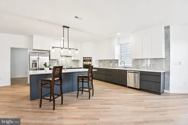 a kitchen with a sink cabinets and window