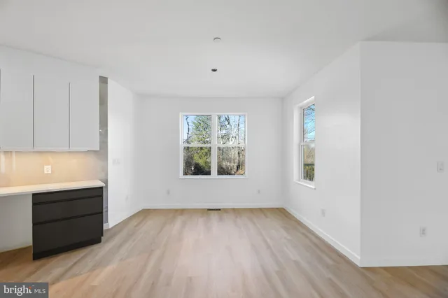a view of entryway with wooden floor