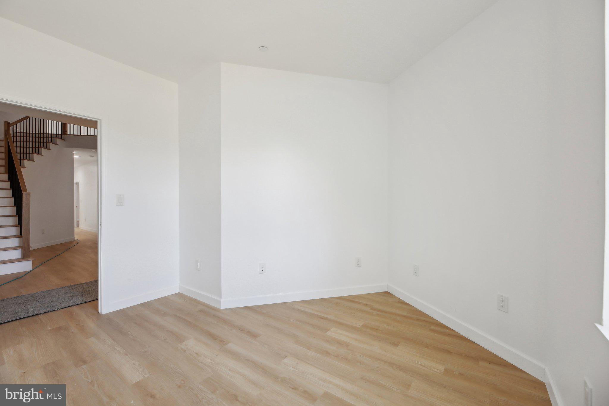 8325 Grove Angle Road Ellicott City, MD 21043 - Photo 17 of 57 a view of empty room with wooden floor