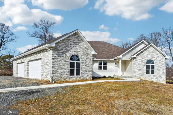 a front view of a house with yard