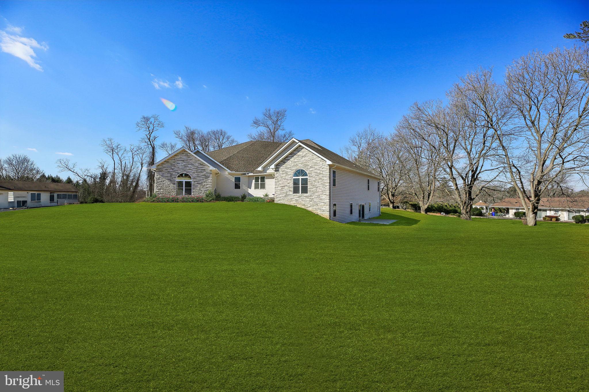 8325 Grove Angle Road Ellicott City, MD 21043 - Photo 2 of 57 a view of a house with a yard