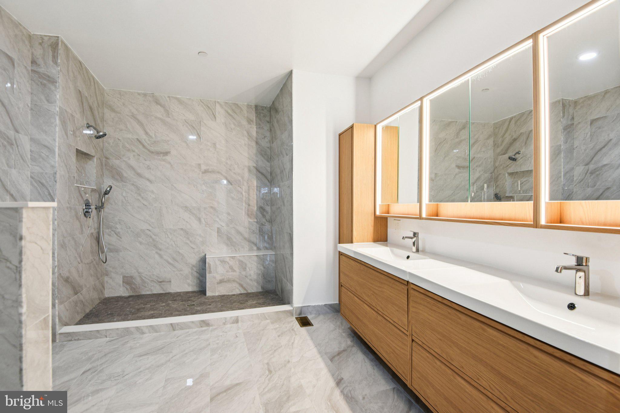 8325 Grove Angle Road Ellicott City, MD 21043 - Photo 29 of 72 a bathroom with a double vanity sink mirror and shower