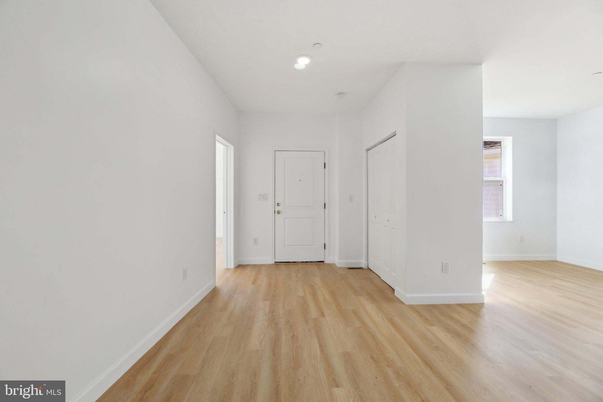 8325 Grove Angle Road Ellicott City, MD 21043 - Photo 3 of 72 a view of a room with wooden floor
