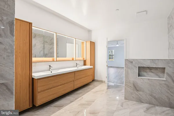 a view of a livingroom with workspace and a couch
