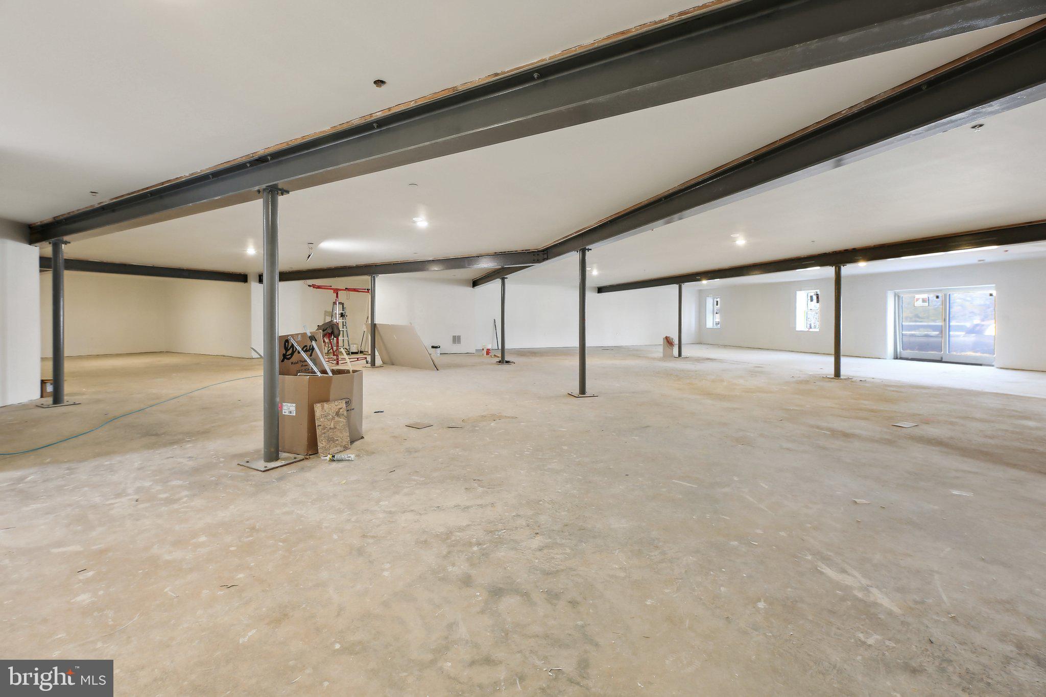 8325 Grove Angle Road Ellicott City, MD 21043 - Photo 44 of 57 a view of a hall with wooden floor