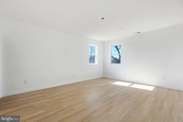 a view of an empty room and a window
