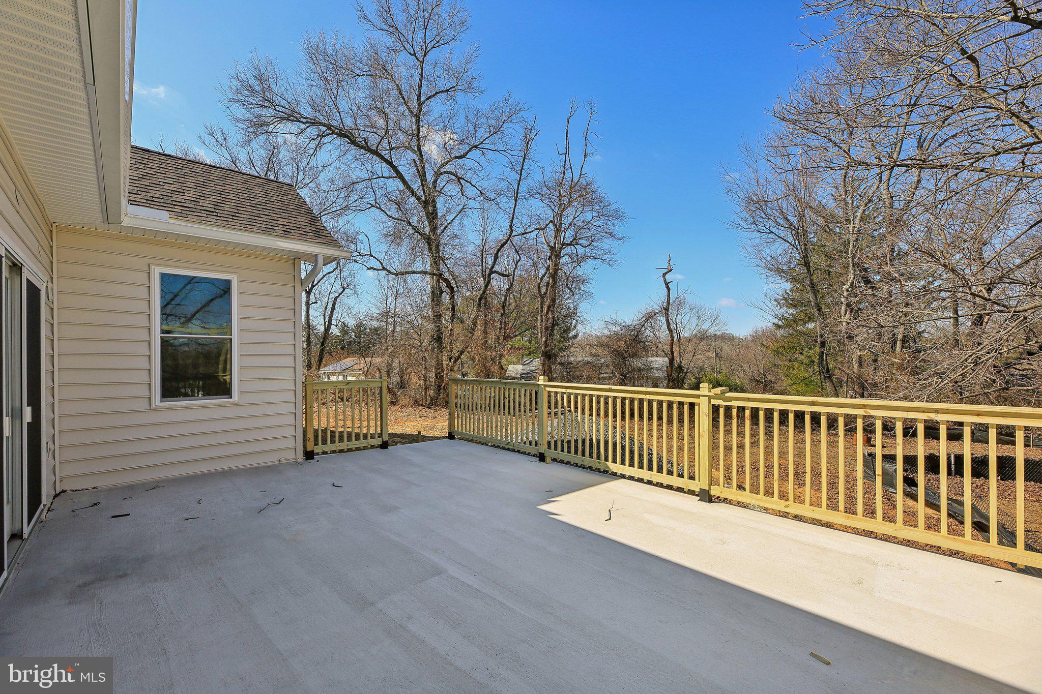 8325 Grove Angle Road Ellicott City, MD 21043 - Photo 49 of 57 a view of a house with a wooden fence