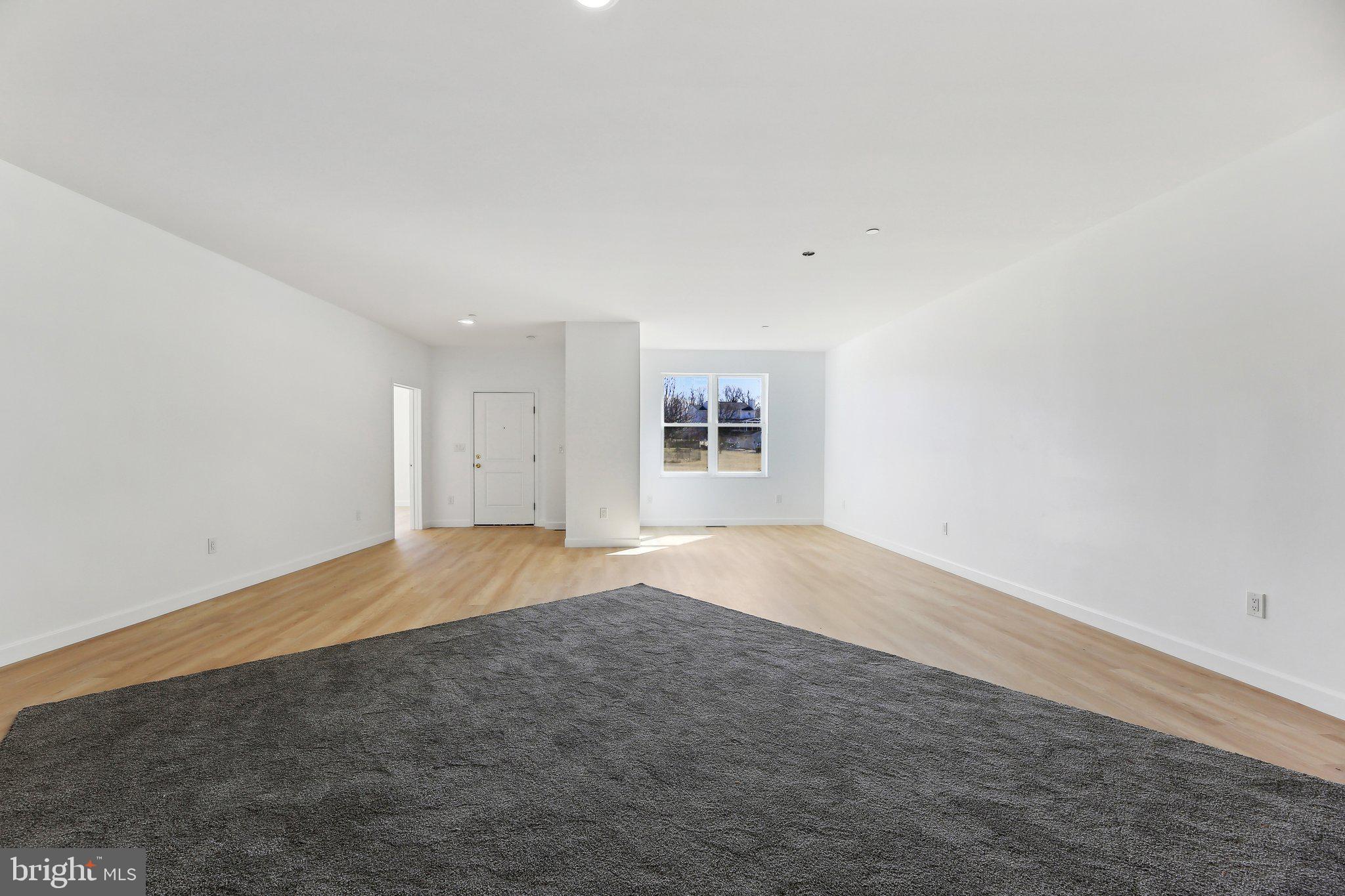 8325 Grove Angle Road Ellicott City, MD 21043 - Photo 5 of 57 an empty room with a empty space and windows