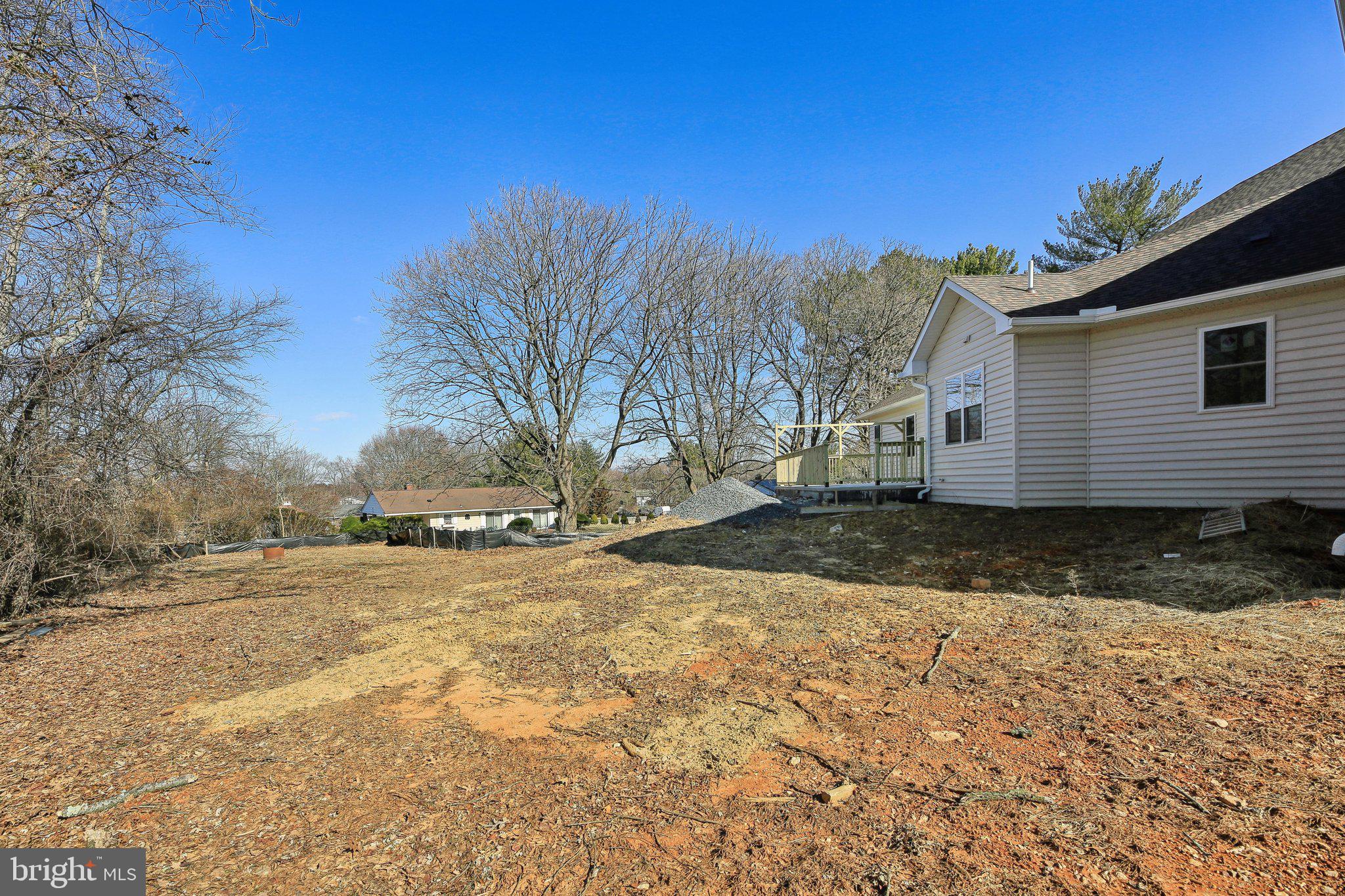 8325 Grove Angle Road Ellicott City, MD 21043 - Photo 52 of 57 a view of a yard with a house