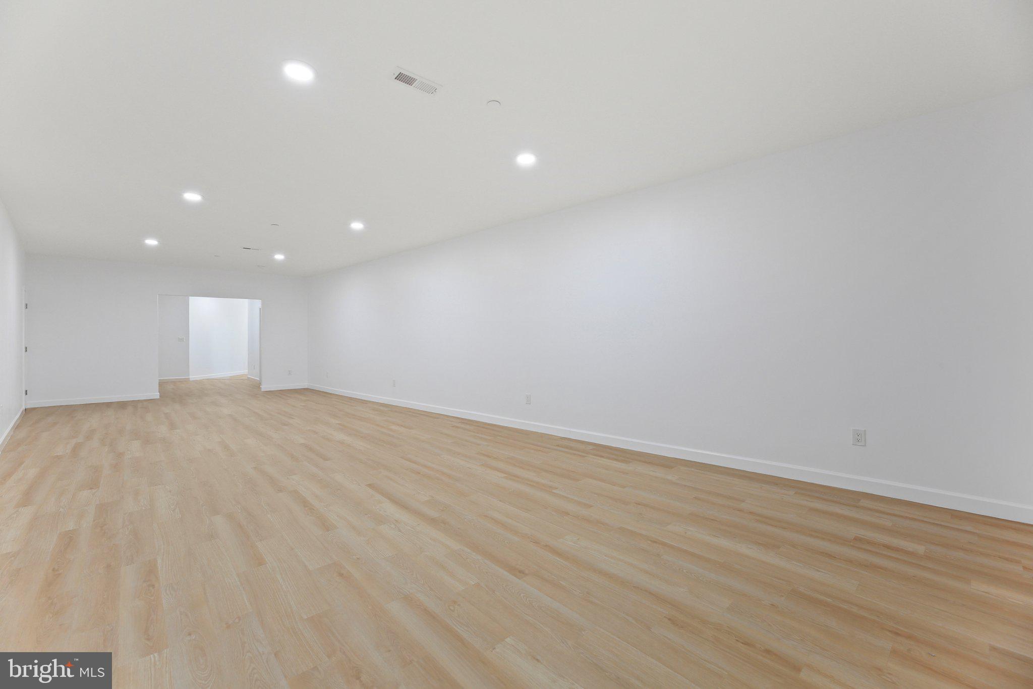 8325 Grove Angle Road Ellicott City, MD 21043 - Photo 54 of 72 a view of empty room with wooden floor
