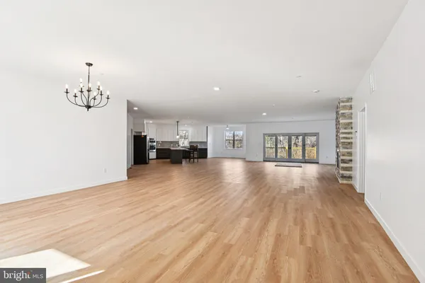a view of a livingroom with furniture and chandelier