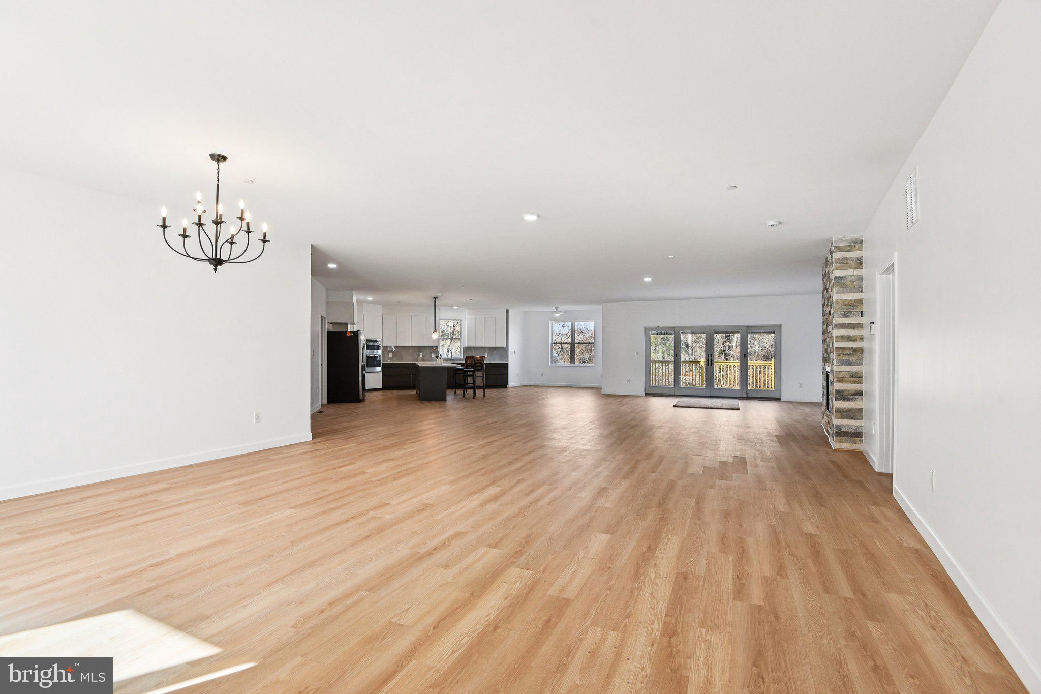 8325 Grove Angle Road Ellicott City, MD 21043 - Photo 6 of 72 a view of a livingroom with furniture and chandelier
