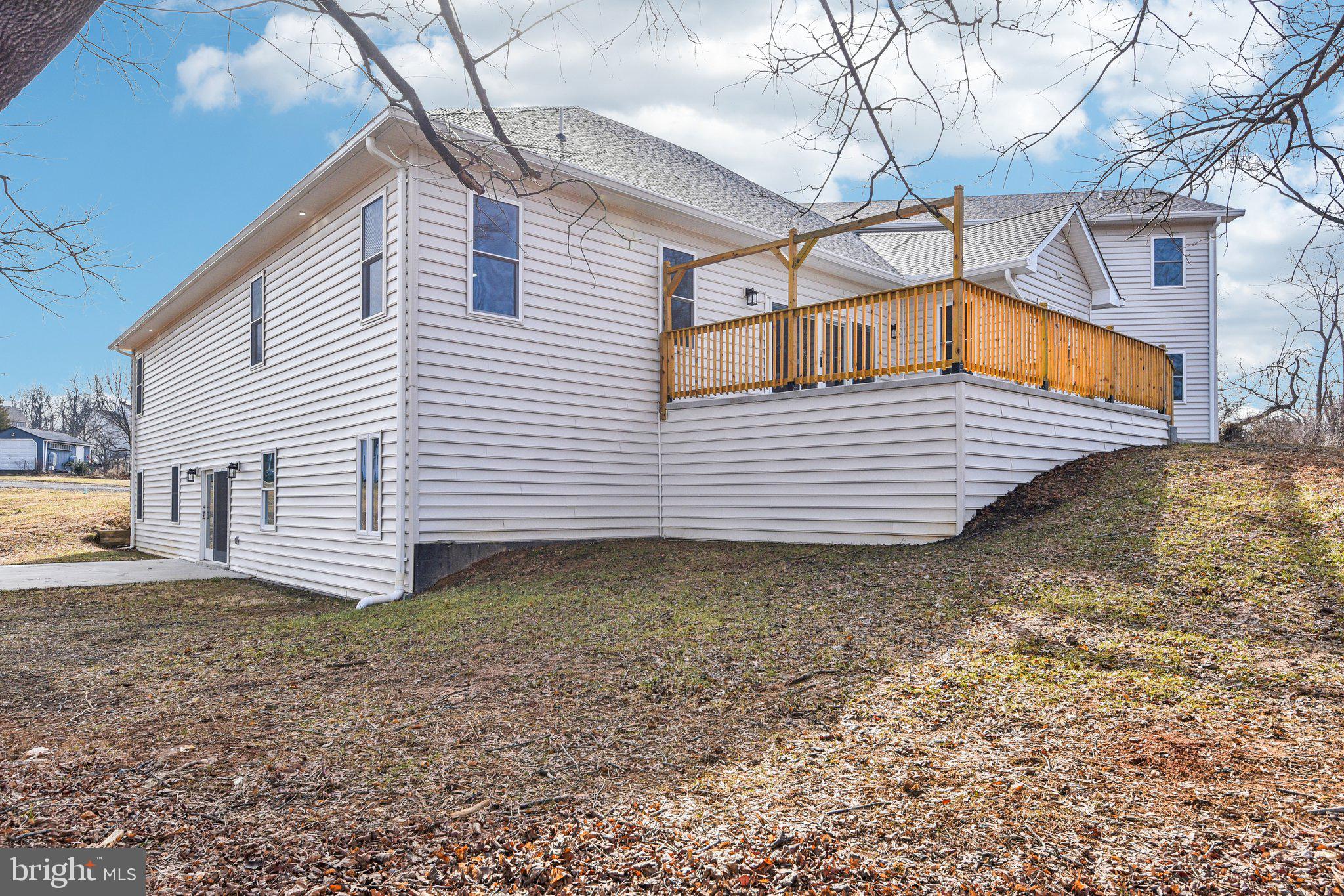 8325 Grove Angle Road Ellicott City, MD 21043 - Photo 66 of 72 a view of a house with a yard