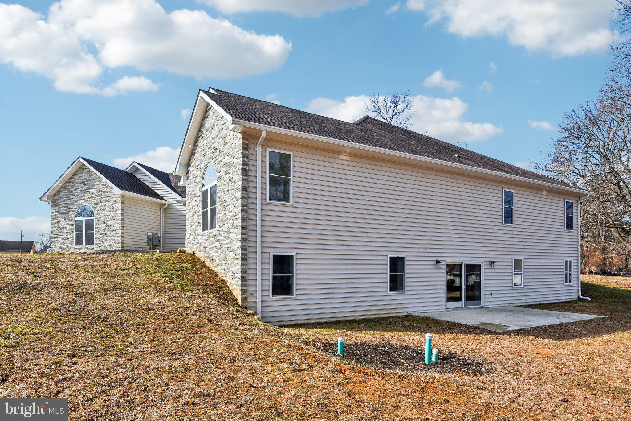 8325 Grove Angle Road Ellicott City, MD 21043 - Photo 68 of 72 a view of a house with a yard