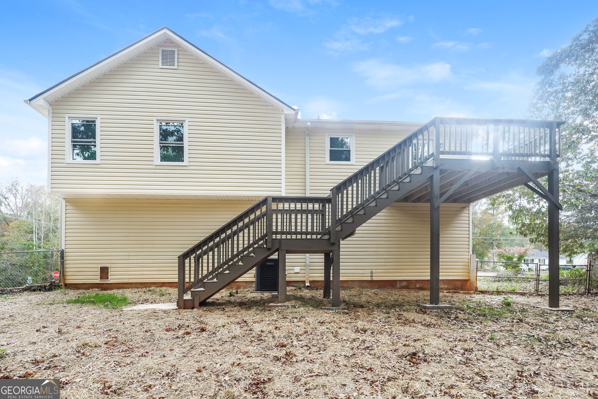 202 Wesley Mill Way Villa Rica, GA 30180 - Photo 15 of 17 a view of a house with a yard