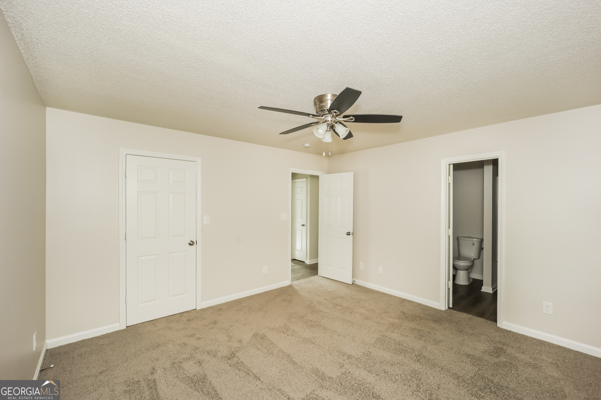 202 Wesley Mill Way Villa Rica, GA 30180 - Photo 8 of 17 a view of a livingroom with a ceiling fan