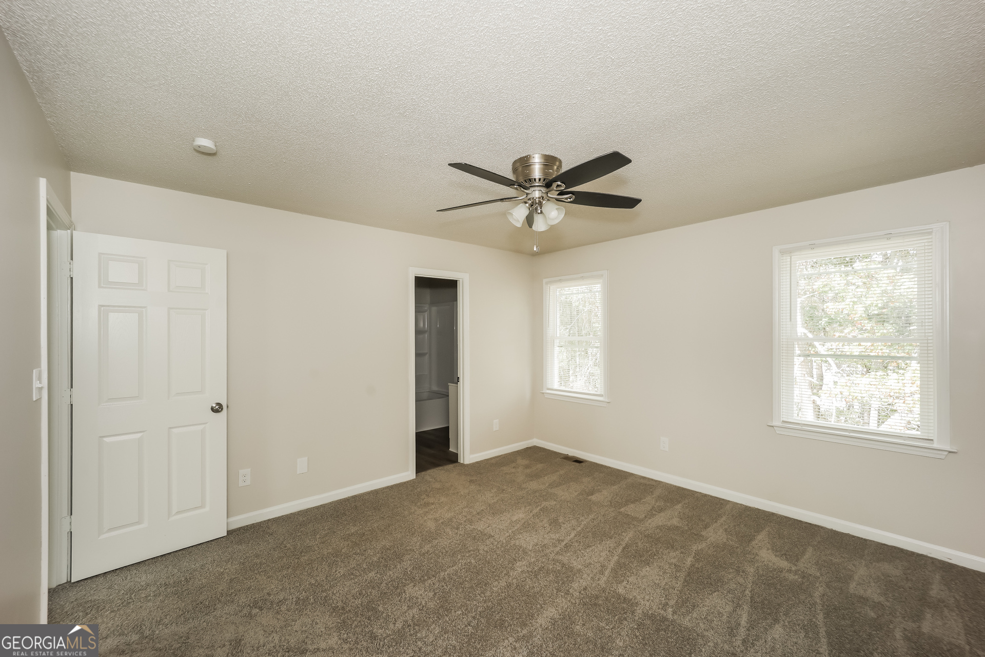 202 Wesley Mill Way Villa Rica, GA 30180 - Photo 9 of 17 a view of a livingroom with a ceiling fan and window