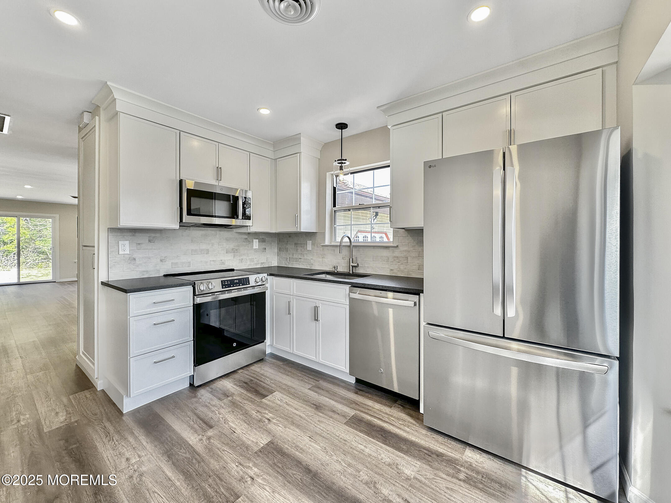 15D Alpine Road, Unit C Whiting, NJ 08759 - Photo 1 of 36 a kitchen with a refrigerator stove and microwave