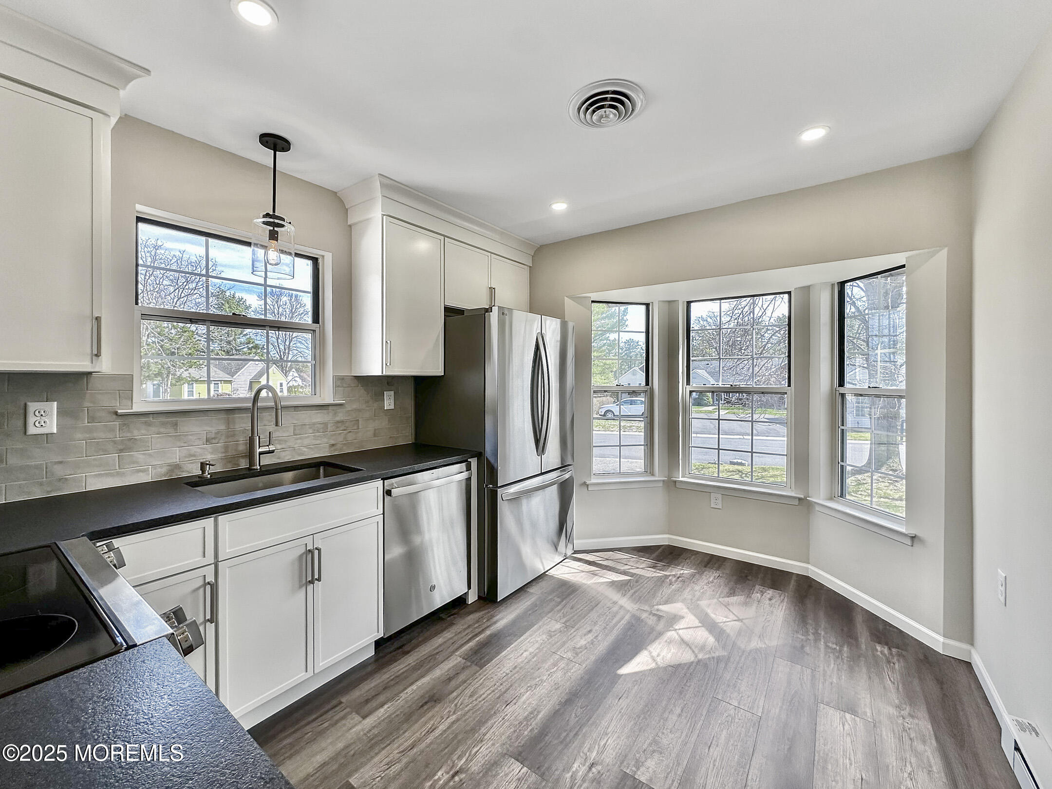 15D Alpine Road, Unit C Whiting, NJ 08759 - Photo 11 of 36 a kitchen with stainless steel appliances granite countertop a sink stove and refrigerator