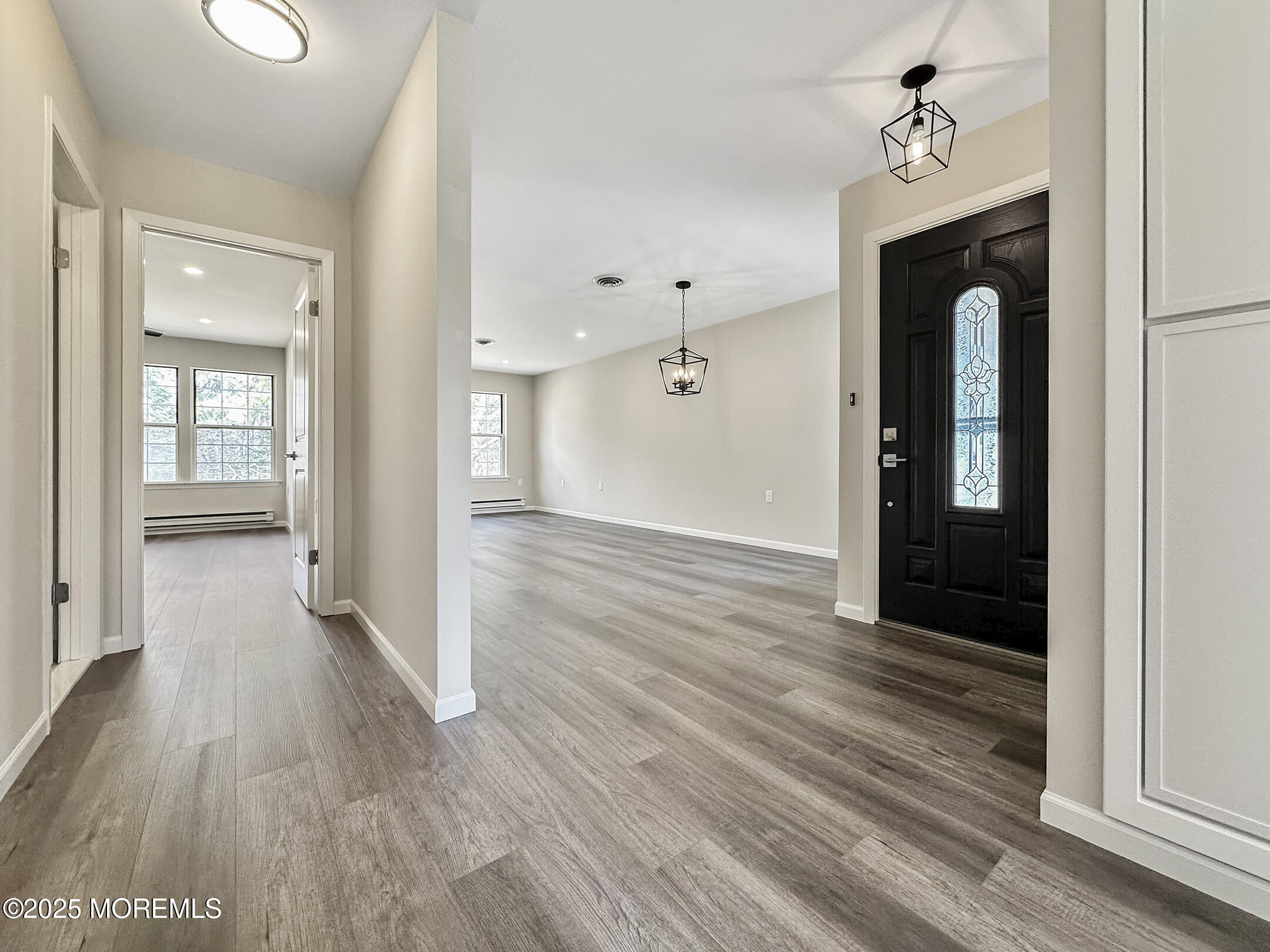 15D Alpine Road, Unit C Whiting, NJ 08759 - Photo 13 of 36 a view of a hallway with wooden floor and a bathroom
