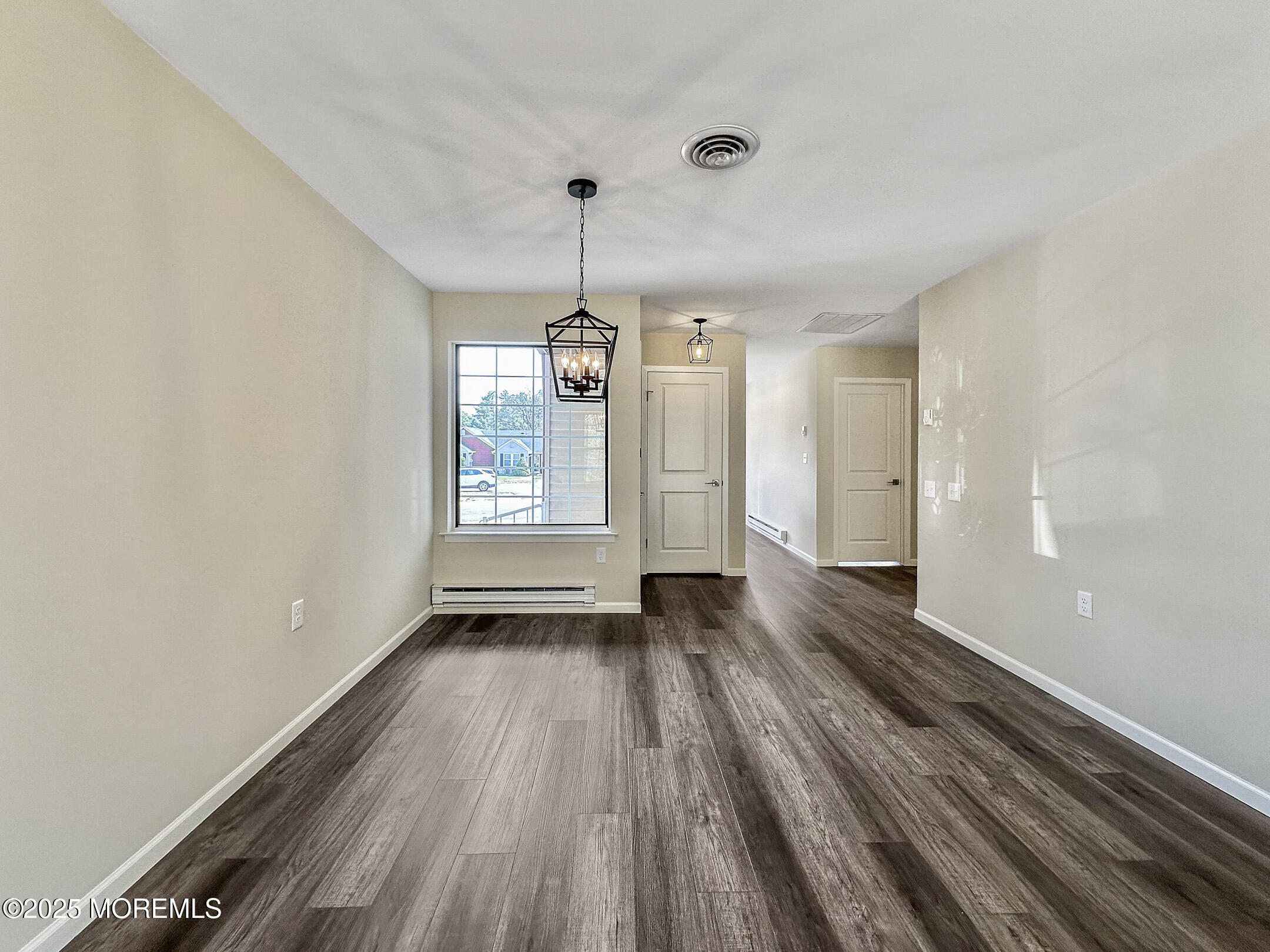 15D Alpine Road, Unit C Whiting, NJ 08759 - Photo 15 of 36 wooden floor in an empty room with a window