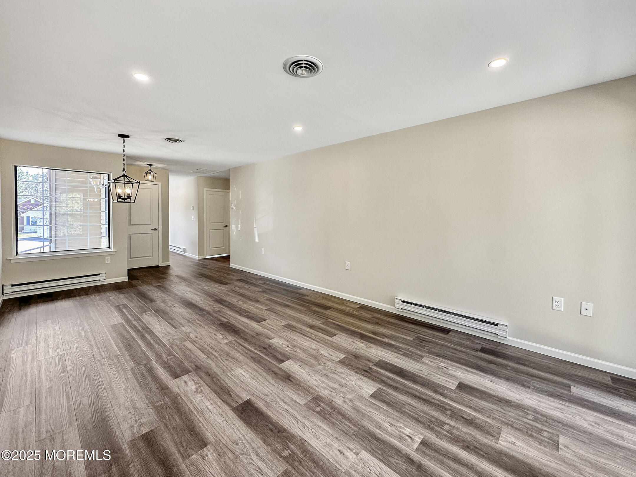 15D Alpine Road, Unit C Whiting, NJ 08759 - Photo 19 of 36 an empty room with wooden floor and window