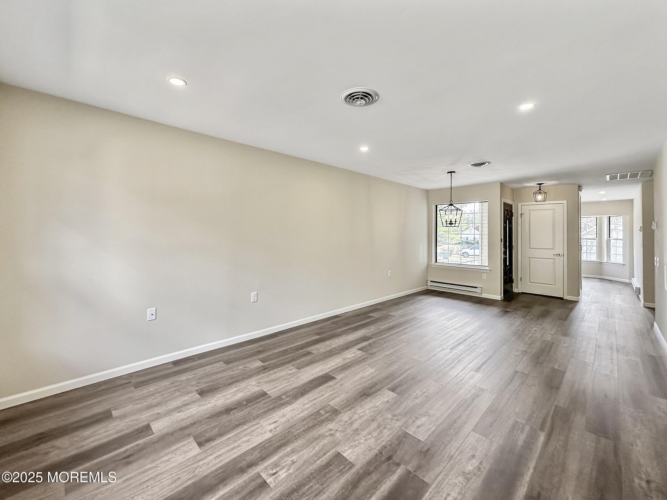 15D Alpine Road, Unit C Whiting, NJ 08759 - Photo 20 of 36 an empty room with wooden floor and windows