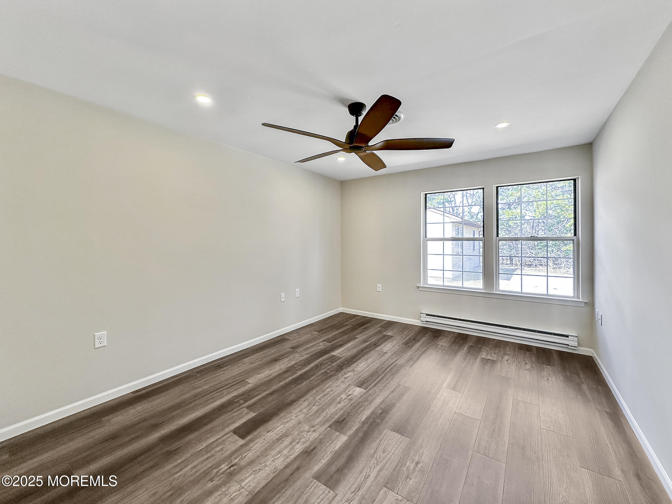 15D Alpine Road, Unit C Whiting, NJ 08759 - Photo 23 of 36 wooden floor in an empty room with a window