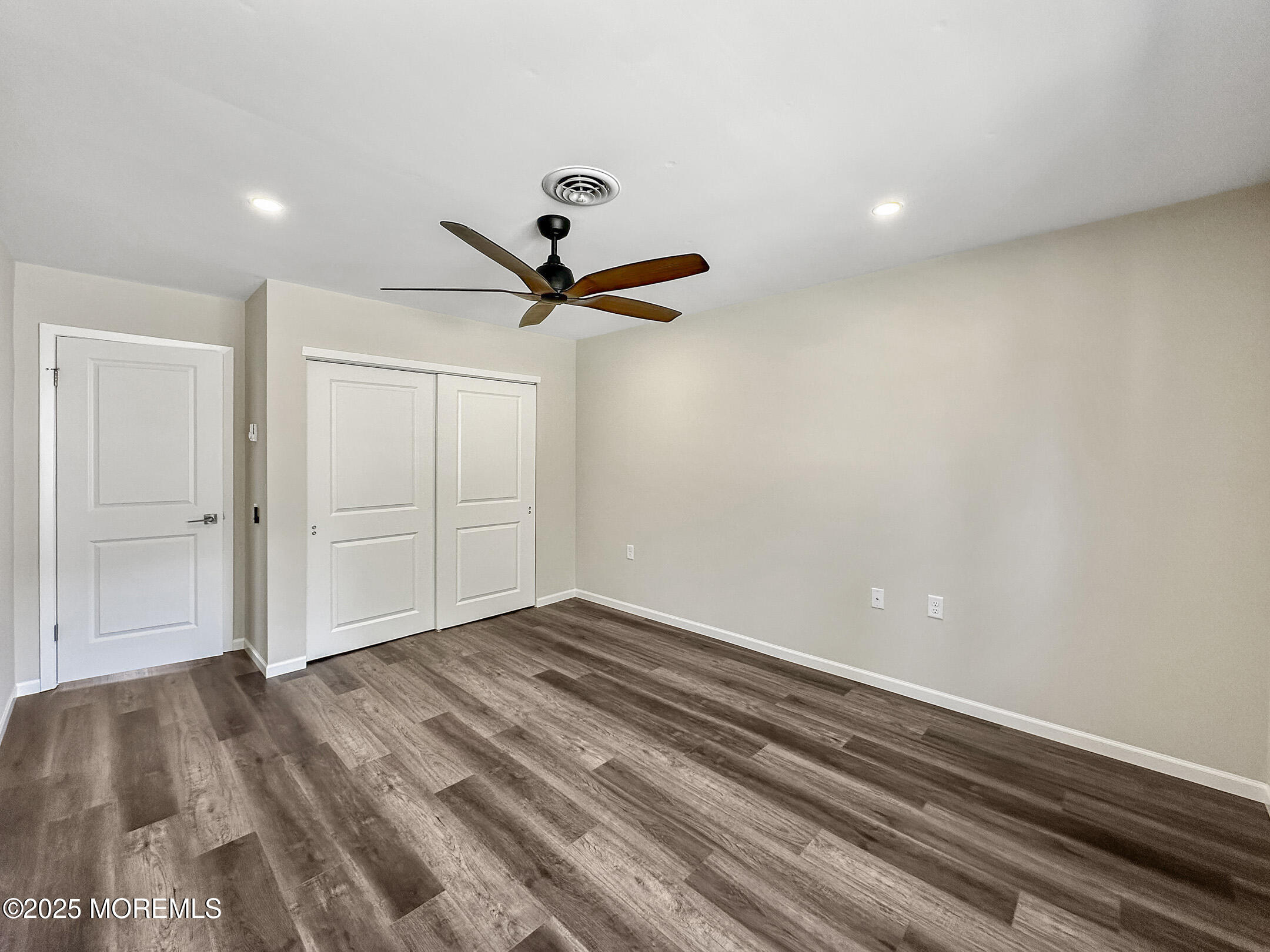15D Alpine Road, Unit C Whiting, NJ 08759 - Photo 24 of 36 a view of empty room with wooden floor
