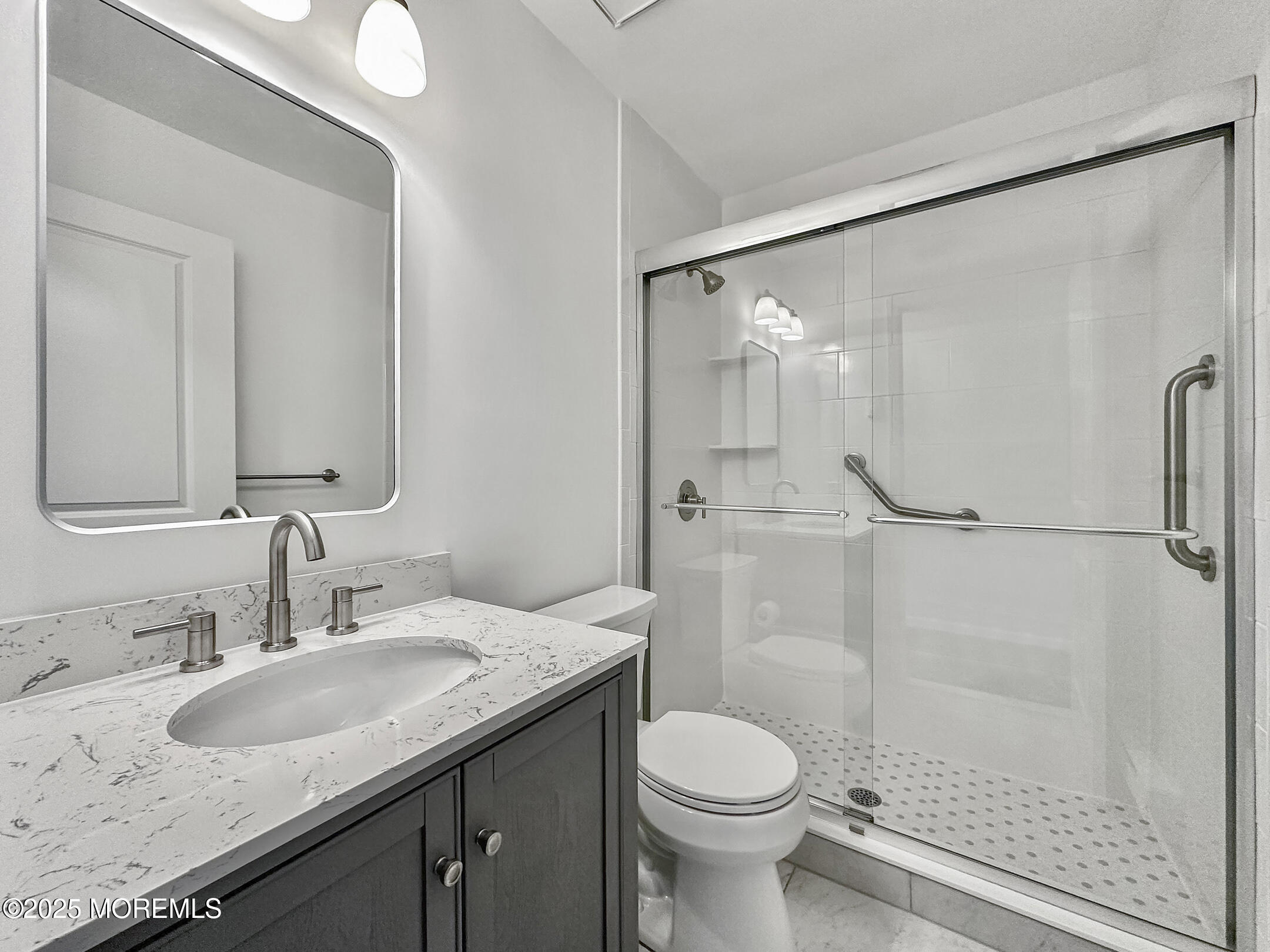 15D Alpine Road, Unit C Whiting, NJ 08759 - Photo 25 of 36 a bathroom with a granite countertop sink toilet and shower