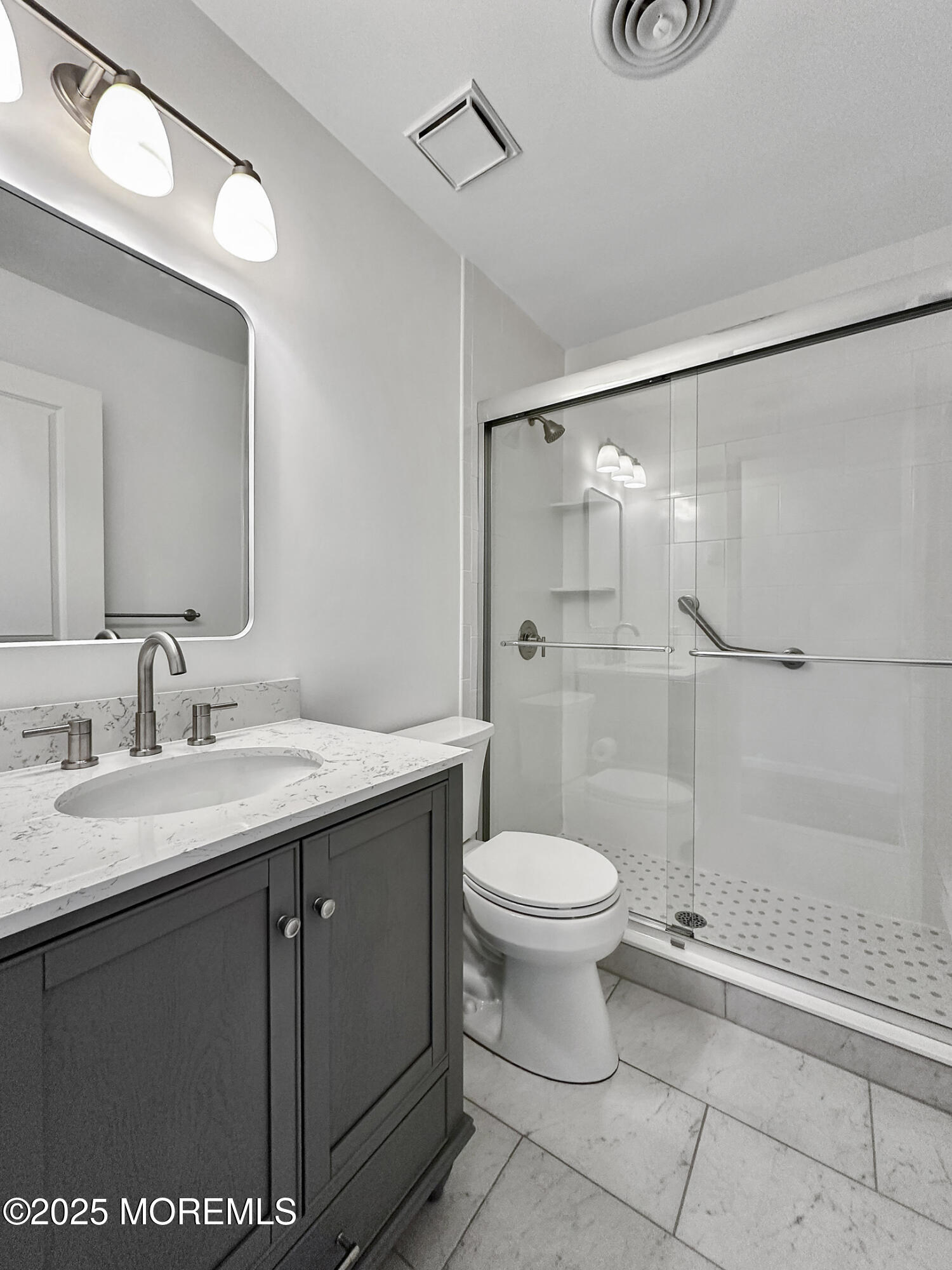 15D Alpine Road, Unit C Whiting, NJ 08759 - Photo 26 of 36 a bathroom with a sink and a mirror