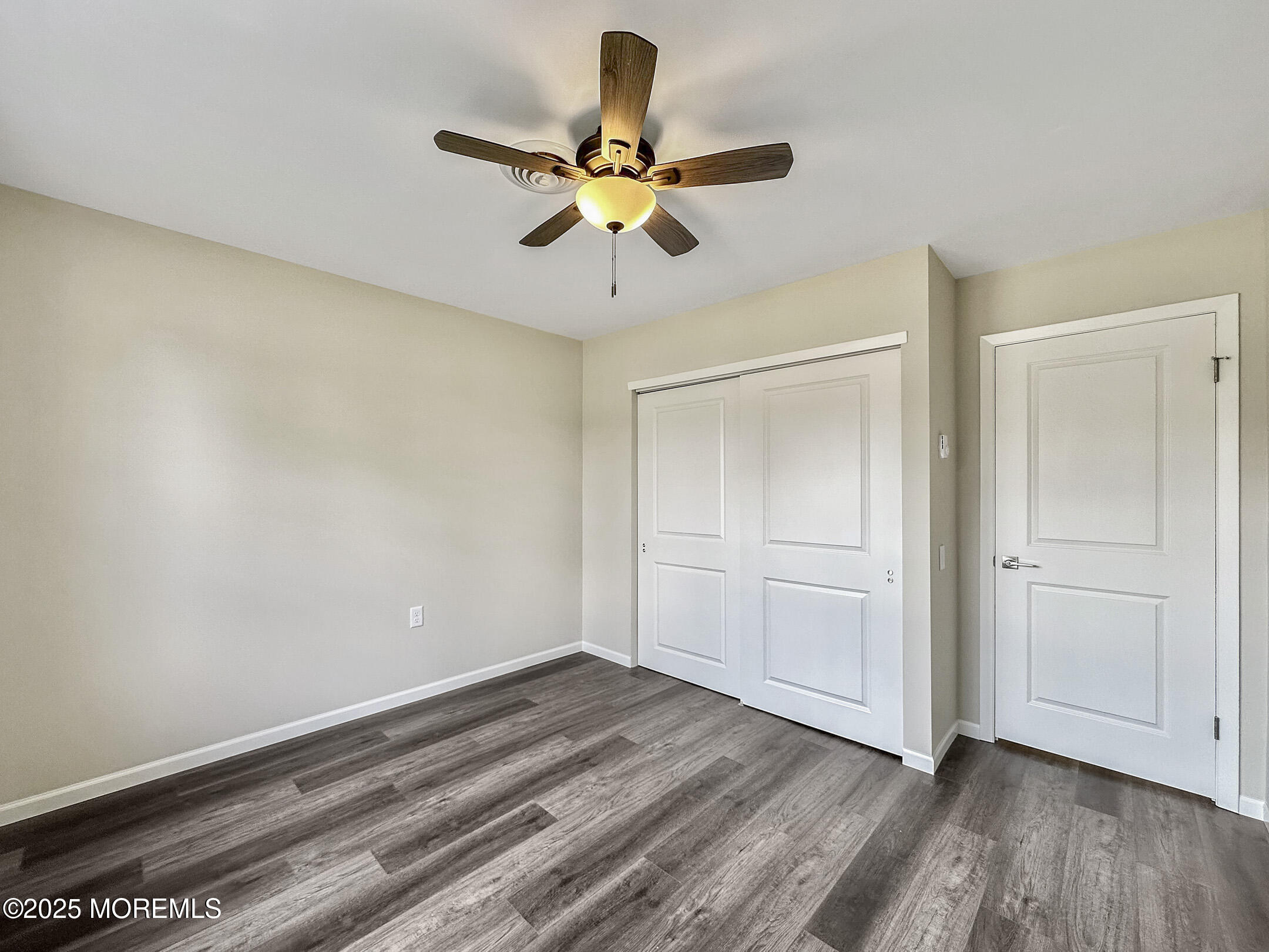 15D Alpine Road, Unit C Whiting, NJ 08759 - Photo 28 of 36 a view of room with hardwood floor and ceiling fan