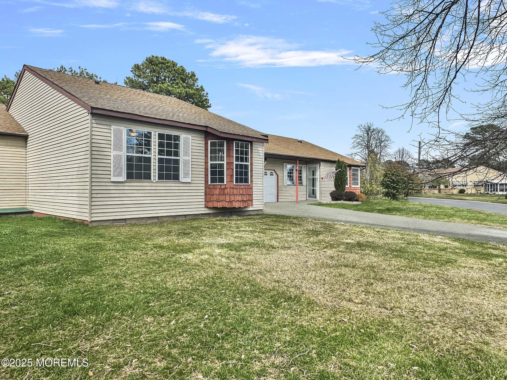 15D Alpine Road, Unit C Whiting, NJ 08759 - Photo 35 of 36 a front view of a house with a garden