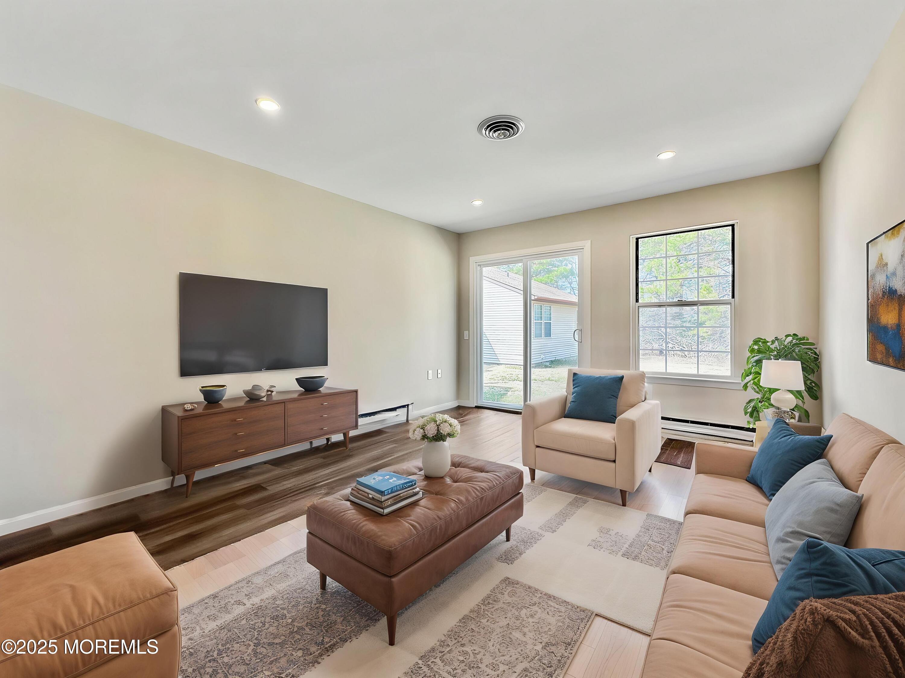 15D Alpine Road, Unit C Whiting, NJ 08759 - Photo 5 of 36 a living room with furniture and a flat screen tv