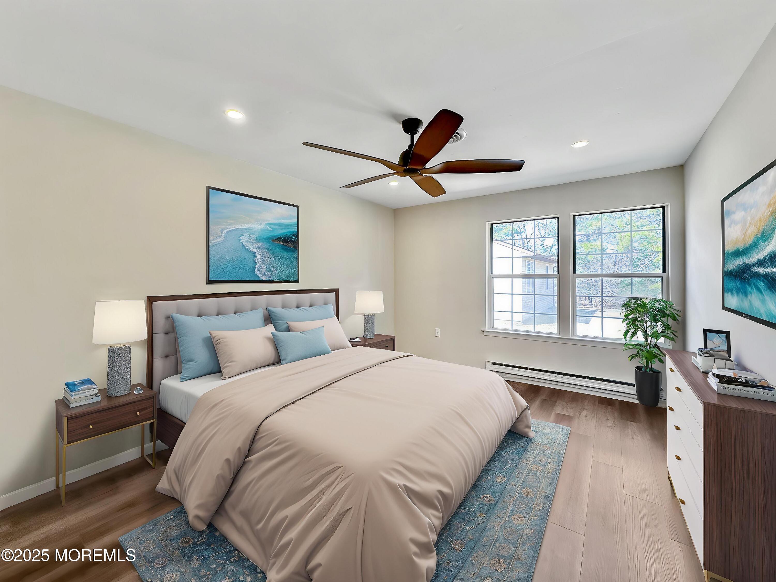 15D Alpine Road, Unit C Whiting, NJ 08759 - Photo 6 of 36 a bedroom with a large bed and a large window