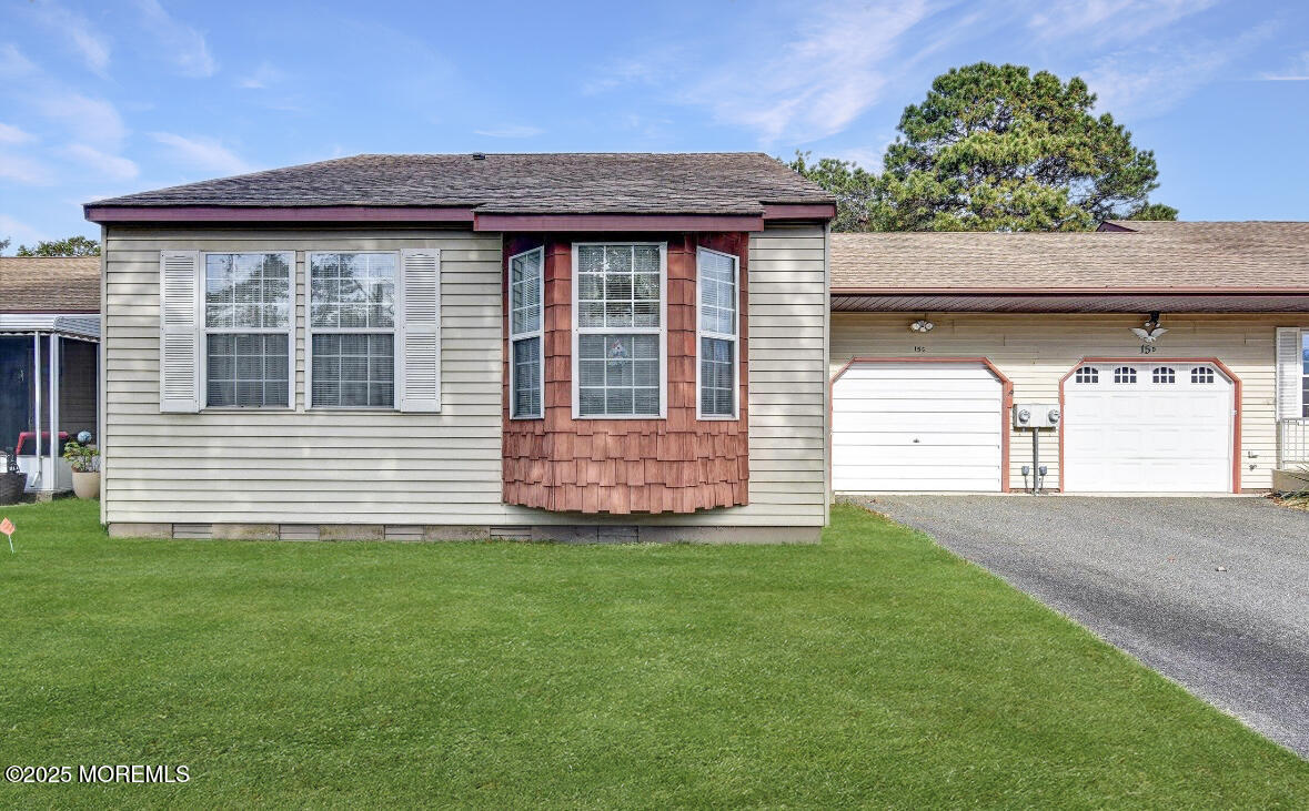 15D Alpine Road, Unit C Whiting, NJ 08759 - Photo 9 of 36 a front view of a house with a garden
