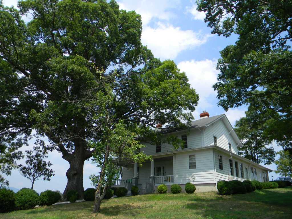 5222 Blacksburg Road Troutville, VA 24175 - Photo 2 of 38 a front view of a house with a garden