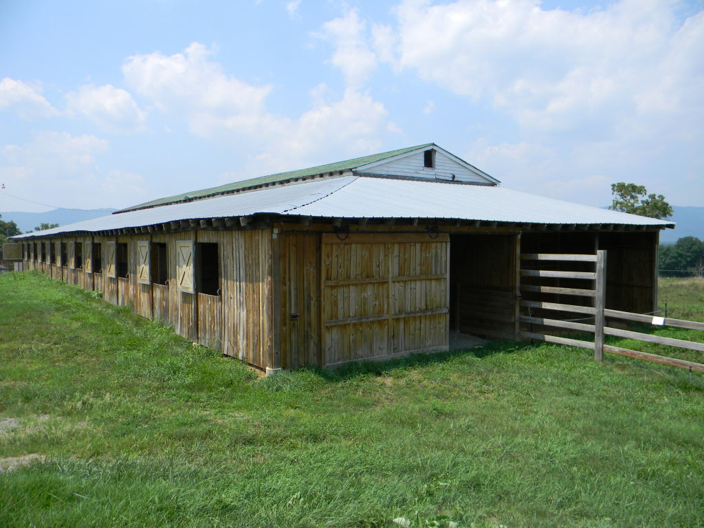 5222 Blacksburg Road Troutville, VA 24175 - Photo 20 of 38 a backyard of a house with lots of green space and wooden fence