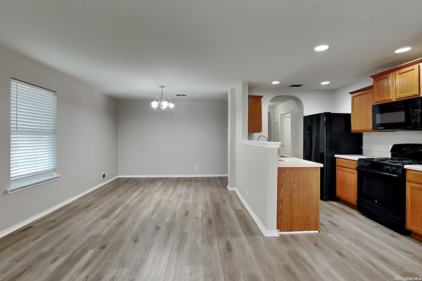 6510 Poseidon Way Converse, TX 78109 - Photo 4 of 16 a view of kitchen with sink microwave refrigerator and stove