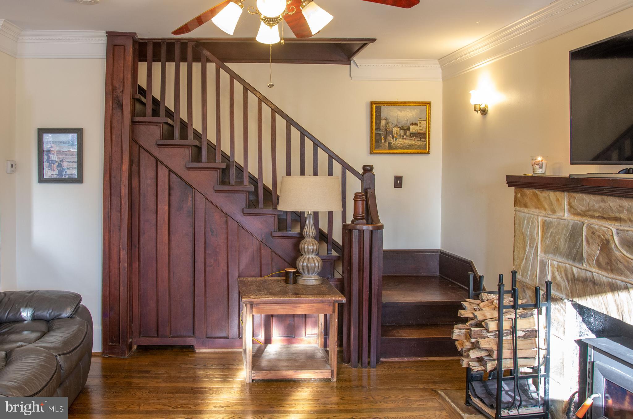 19201 Cardinal Heights Road Triangle, VA 22172 - Photo 3 of 66 Warm woodwork gives the living room a cozy feel.