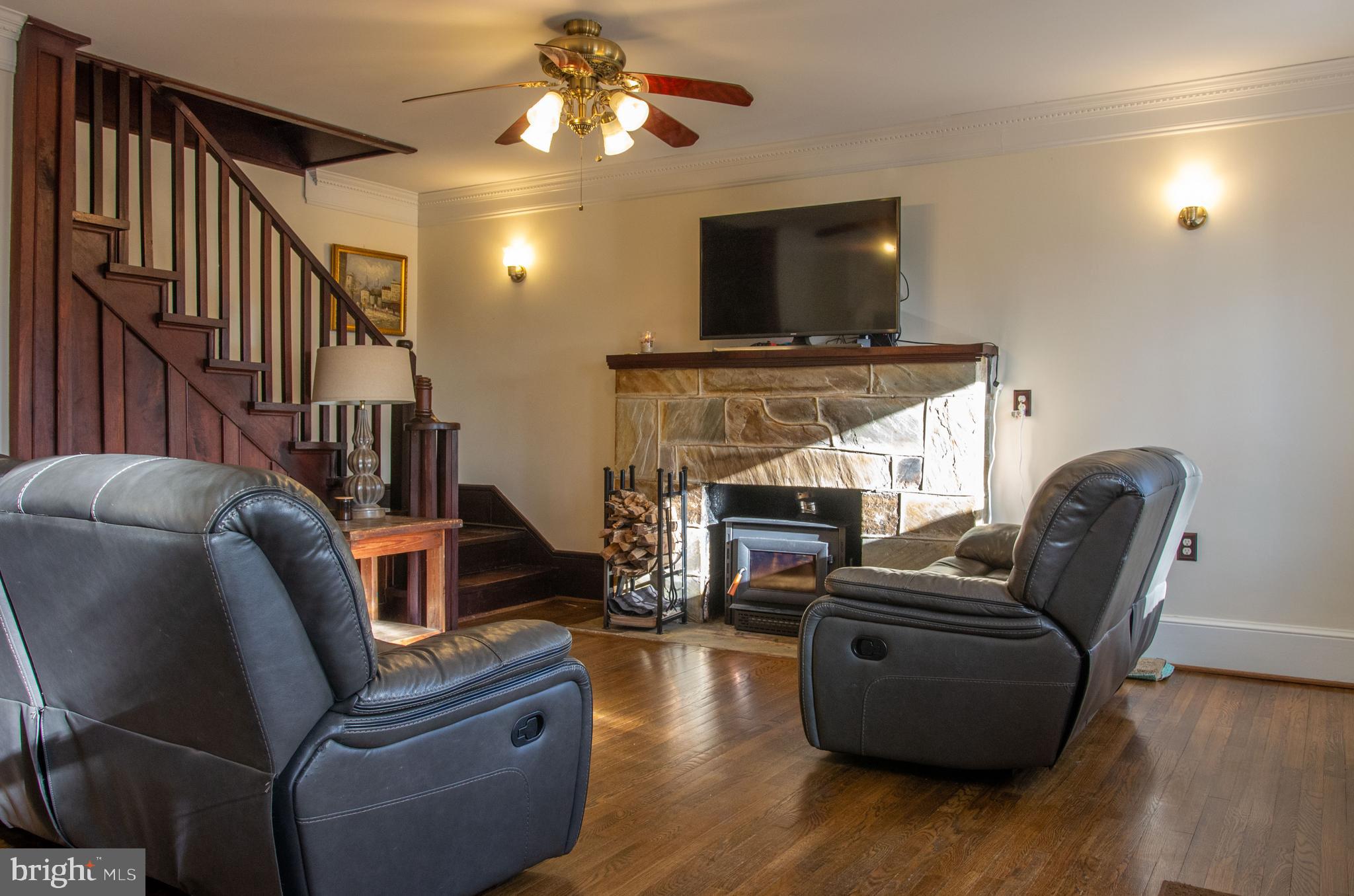 19201 Cardinal Heights Road Triangle, VA 22172 - Photo 4 of 66 Living room wood burning fireplace w/stone mantel