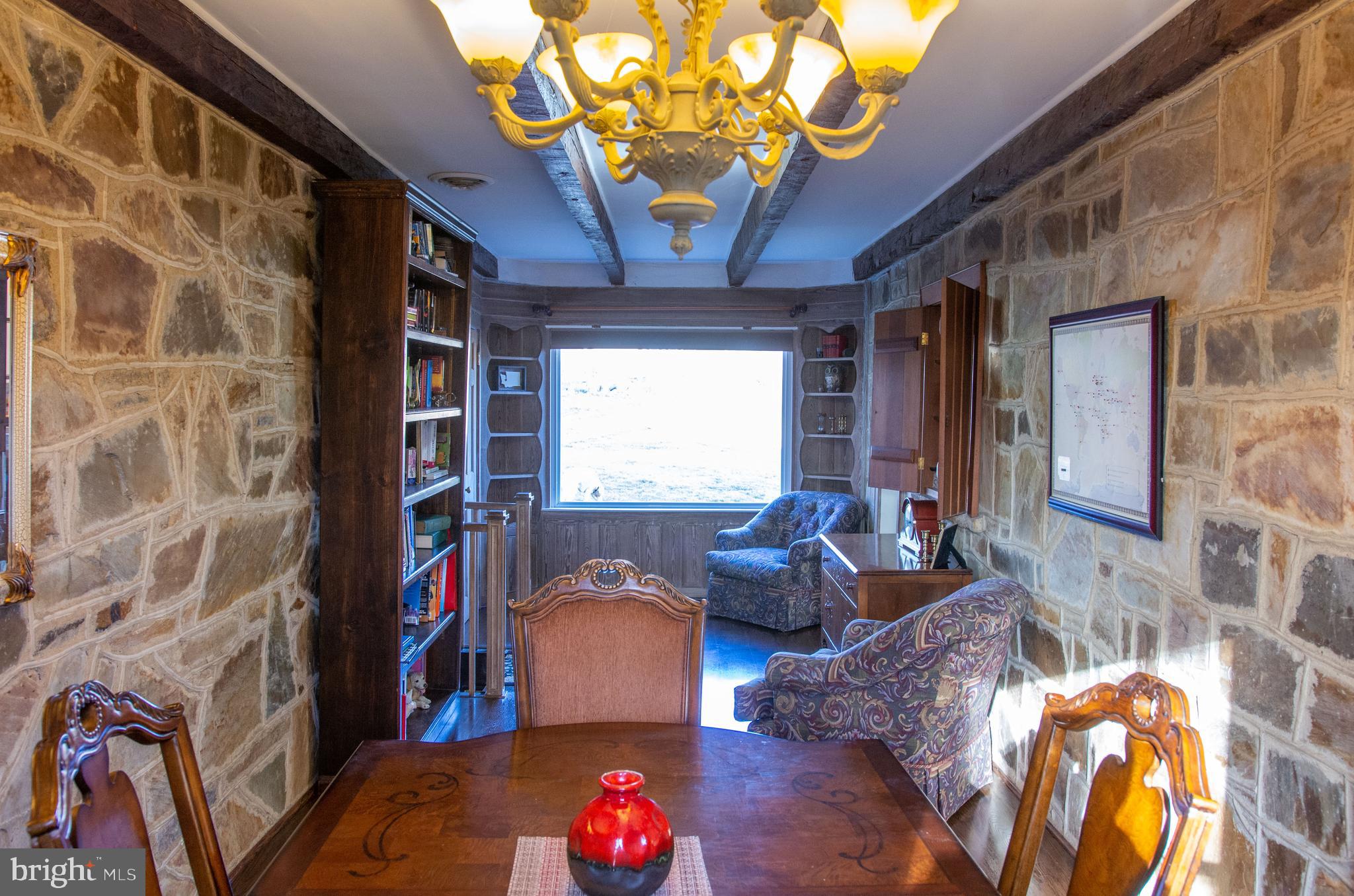 19201 Cardinal Heights Road Triangle, VA 22172 - Photo 9 of 66 DR features stonework and wood builtin bookshelves