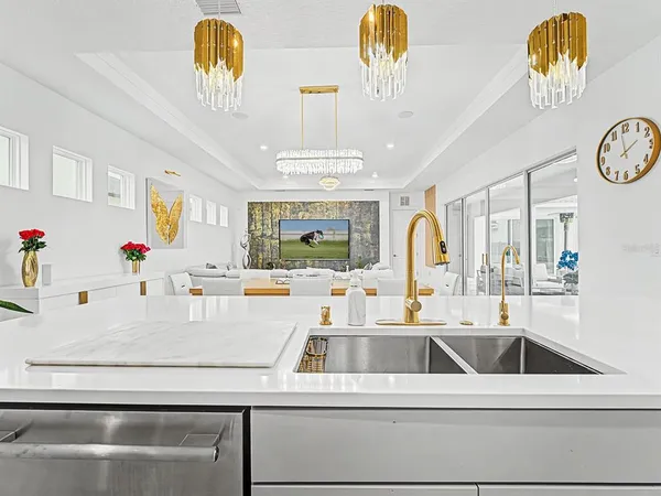 a kitchen with kitchen island a table and chairs in it